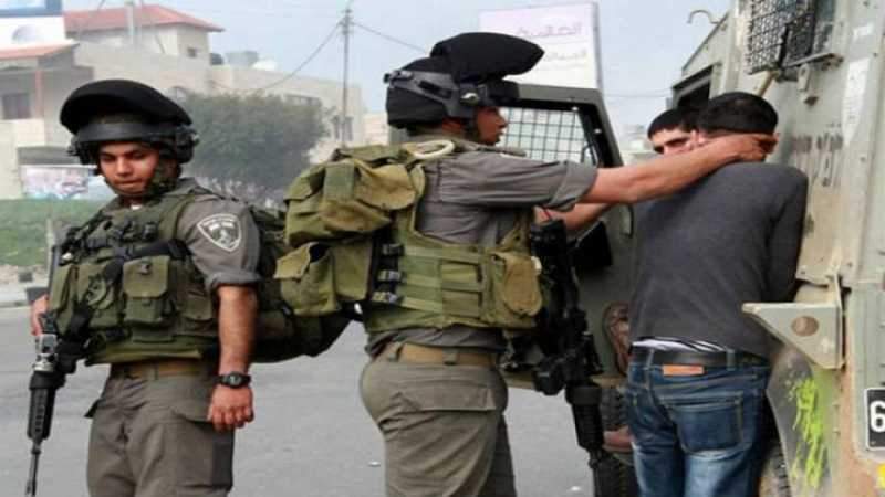 قوات العدو تعتقل 14 فلسطينيا من الضفة الغربية