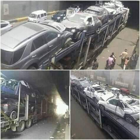 عااااجل بالصور .. حادث مروري مروع قاطره محملة بالسيارات الأمريكية تعلق في نفق بصنعاء
